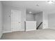 Versatile bonus room with neutral walls, carpeting, and multiple access doors, offering flexibility and comfort at 2017 Embassy Ct # 51, Charlotte, NC 28213