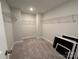 Walk-in closet with carpet flooring, wire shelving and neutral paint at 2017 Embassy Ct # 51, Charlotte, NC 28213