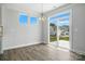 Dining area with backyard view and modern chandelier at 2017 Embassy Ct # 51, Charlotte, NC 28213