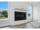 Modern fireplace with mantle set between two windows gives this living space natural light at 2017 Embassy Ct # 51, Charlotte, NC 28213