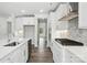 Modern kitchen with stainless appliances, marble backsplash, and an adjacent eating area at 2017 Embassy Ct # 51, Charlotte, NC 28213