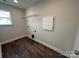 Laundry room with shelving and wood-look flooring at 2017 Embassy Ct # 51, Charlotte, NC 28213