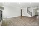 Large living room boasts hardwood floors, lots of light, and stair access at 2017 Embassy Ct # 51, Charlotte, NC 28213