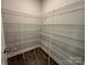 Walk-in pantry with metal shelving, providing ample storage space at 2017 Embassy Ct # 51, Charlotte, NC 28213