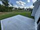Concrete patio surrounded by green grass at 2017 Embassy Ct # 51, Charlotte, NC 28213