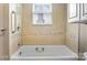 Clean and well-maintained bathtub with neutral tile surround at 203 Ackert Ave, Salisbury, NC 28144