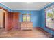 Bright bedroom showcasing hardwood floors, natural light, and traditional woodwork at 203 Ackert Ave, Salisbury, NC 28144