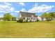 Charming single-story home featuring a well-manicured lawn, classic shutters, and mature trees at 203 Ackert Ave, Salisbury, NC 28144