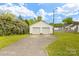 Two-car detached garage providing ample parking and storage space, surrounded by mature landscaping at 203 Ackert Ave, Salisbury, NC 28144