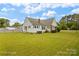 Quaint single-story home with brick accents, classic shutters surrounded by expansive lawn at 203 Ackert Ave, Salisbury, NC 28144