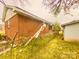 Side view of a brick home with some lawn debris at 204 Lloyd St, Salisbury, NC 28144