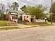A home with a brick exterior and landscaping in need of some TLC from the street view at 204 Lloyd St, Salisbury, NC 28144