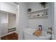 Bright bathroom with a freestanding tub and floating shelves, creating a spa-like experience at 2066 Marquesas Ave, Fort Mill, SC 29708
