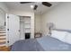 Cozy bedroom featuring built in storage, ceiling fan and a neutral color palette at 2066 Marquesas Ave, Fort Mill, SC 29708