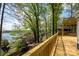 Inviting deck showcasing scenic lake views surrounded by lush greenery, perfect for enjoying nature's beauty at 2066 Marquesas Ave, Fort Mill, SC 29708