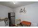 Dining area with a stainless-steel refrigerator, table, and charming wall decor at 2066 Marquesas Ave, Fort Mill, SC 29708