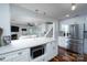 Open concept kitchen with white countertops, stainless steel appliances, and wood floors at 2066 Marquesas Ave, Fort Mill, SC 29708