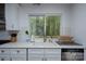 Kitchen with white countertops, updated stainless appliances, and view to backyard at 2066 Marquesas Ave, Fort Mill, SC 29708