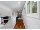 Second floor landing with built-in office nook and hardwood floors at 2066 Marquesas Ave, Fort Mill, SC 29708