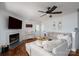 Cozy living room with a fireplace, neutral décor, and comfortable seating, perfect for relaxation at 2066 Marquesas Ave, Fort Mill, SC 29708