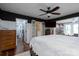 Spacious main bedroom featuring an ensuite bathroom, tv, and floral wallpaper at 2066 Marquesas Ave, Fort Mill, SC 29708