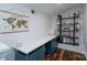 Bright home office with a large desk, shelving, and natural light at 2066 Marquesas Ave, Fort Mill, SC 29708