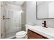 This bathroom showcases modern fixtures, including a sleek vanity and glass-enclosed shower with neutral tiling at 2094 Euclid Ave, Charlotte, NC 28203