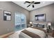 Relax in this bedroom with neutral walls, hardwood floors, and a slider to the balcony for fresh air at 2094 Euclid Ave, Charlotte, NC 28203