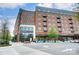 A multi-story brick building with retail spaces, balconies, and modern windows offers urban style at 2094 Euclid Ave, Charlotte, NC 28203