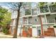 Modern townhome with gray siding, brick accents, and large windows at 2094 Euclid Ave, Charlotte, NC 28203