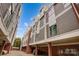 Modern townhome complex with brick accents, visible parking, and contemporary design, creating a stylish urban living at 2094 Euclid Ave, Charlotte, NC 28203