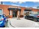 Atherton Mill's brick exterior showcases retail spaces with convenient parking, blending history with modern shopping appeal at 2094 Euclid Ave, Charlotte, NC 28203