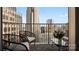Inviting balcony featuring lounge chairs and a table overlooking the cityscape at 210 N Church St # 3507, Charlotte, NC 28202