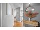 Hallway with light wood floors, gray walls, and decor at 210 N Church St # 3507, Charlotte, NC 28202