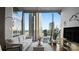 Cozy living room featuring cityscape views and modern furnishings at 210 N Church St # 3507, Charlotte, NC 28202