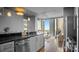 Modern kitchen with an open view to a furnished living room at 210 N Church St # 3507, Charlotte, NC 28202