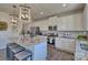 Bright, modern kitchen featuring stainless steel appliances, granite countertops, an island with seating, and stylish pendant lighting at 216 Coronado Ave, Matthews, NC 28104