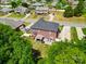 Aerial view of the brick home with a patio and outdoor seating area in a neighborhood at 2808 Park Ridge Blvd, Rock Hill, SC 29732