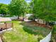 This property features a sprawling backyard with a basketball court, shed, pergola, and lush landscaping at 2808 Park Ridge Blvd, Rock Hill, SC 29732