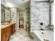 Modern bathroom with double sink vanity, stone tile, walk-in shower and decorative tile flooring and a walk-in closet at 2808 Park Ridge Blvd, Rock Hill, SC 29732