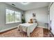 Bright bedroom featuring a comfortable bed, large window, and stylish decor at 2808 Park Ridge Blvd, Rock Hill, SC 29732