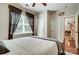 Bright bedroom with ceiling fan, closet, white bedding, dark curtains and view to the hallway at 2808 Park Ridge Blvd, Rock Hill, SC 29732