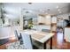 Open concept dining area with a view into the kitchen and living space, showcasing natural light at 2808 Park Ridge Blvd, Rock Hill, SC 29732