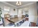 Dining room view showcases open floor plan into kitchen, hardwood floors, and modern lighting at 2808 Park Ridge Blvd, Rock Hill, SC 29732