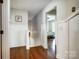 Hallway with wood floors, white walls with a peek into a bedroom and a stairway at 2808 Park Ridge Blvd, Rock Hill, SC 29732