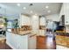 Open kitchen layout with granite countertops, white cabinets, and modern stainless steel appliances at 2808 Park Ridge Blvd, Rock Hill, SC 29732