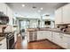 White kitchen with stainless steel appliances and granite countertops open to dining at 2808 Park Ridge Blvd, Rock Hill, SC 29732