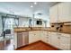 Bright kitchen boasts stainless steel appliances, granite countertops, and sleek white cabinetry at 2808 Park Ridge Blvd, Rock Hill, SC 29732