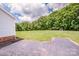 Spacious backyard with treeline and a shed, offering privacy and ample space for outdoor activities at 2811 Saint James Church Rd, Denver, NC 28037