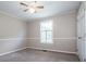 Bedroom with wall trim, a ceiling fan and natural lighting at 2811 Saint James Church Rd, Denver, NC 28037